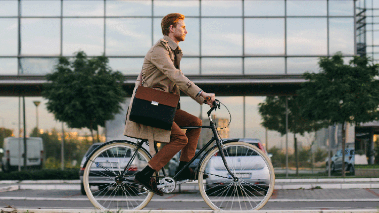 Businessman cycling to work