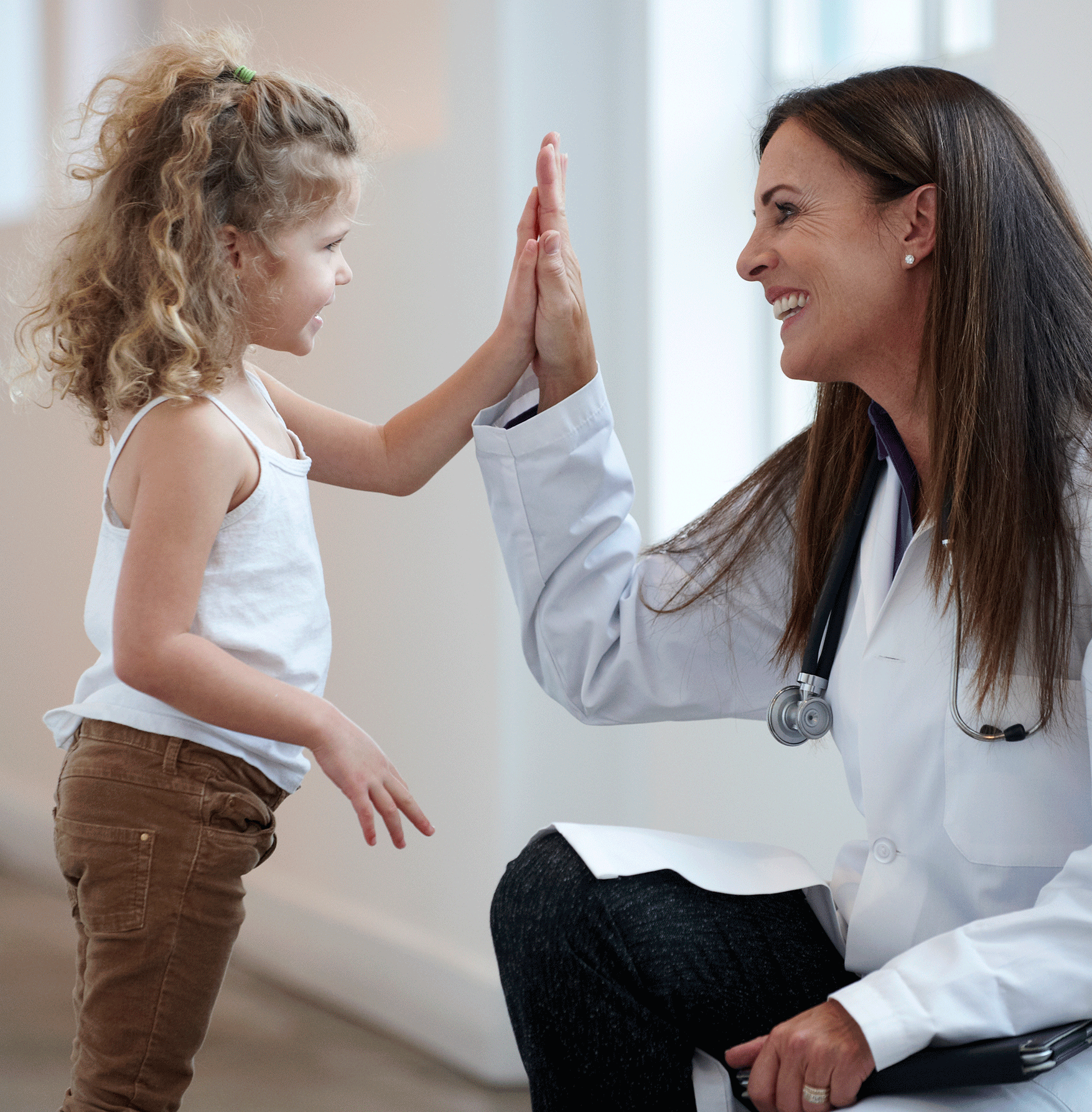 Mother and daughter compare hands