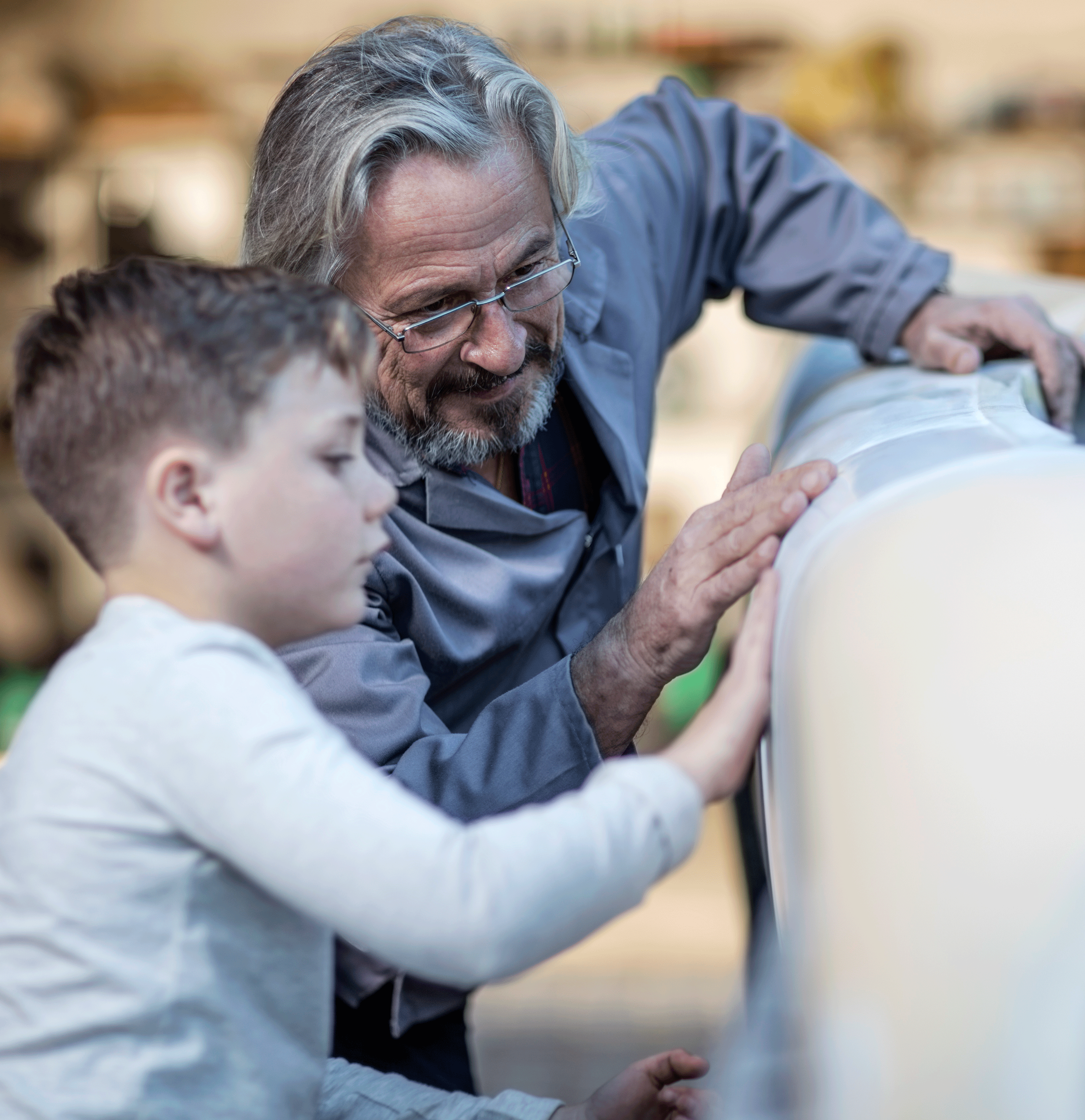 Grandfather and grandson building